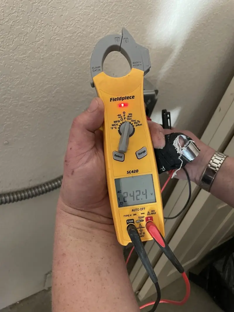 Voltage testing with clamp meter during Electrical Installation Services in San Clemente